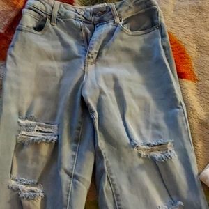 Flared ripped blue jeans